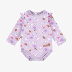 Cache-couche Mauve à Motifs, Naissance