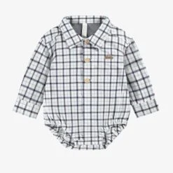 Chemise Cache-couche à Carreaux, Naissance